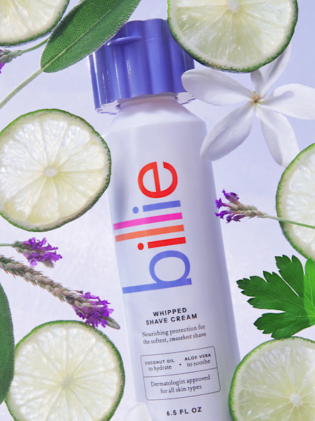 Image of the whipped shave cream in the lavender scent with lime slices and lavender in the background