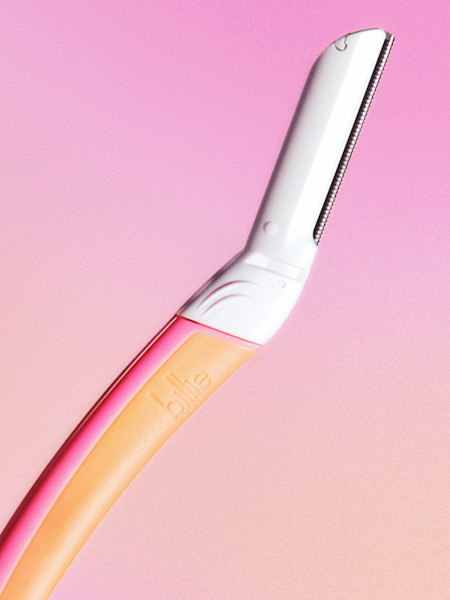 malibu dermaplane in front of a pink and orange background