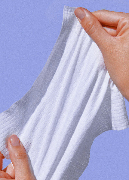 hands stretching out a wonder wipe
