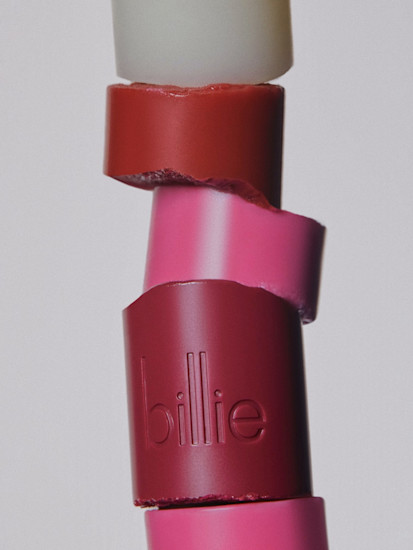 A stack of pieces of different Billie Super Salve flavors against a light grey background.