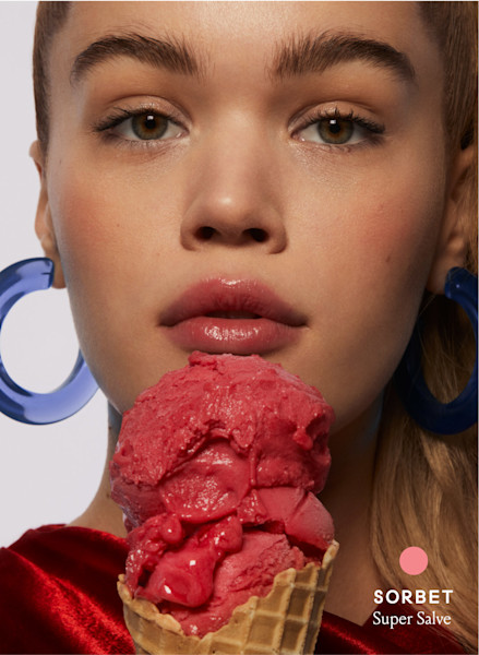 model holding an ice cream cone filed with Sorbet.