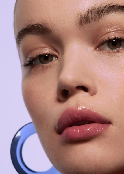 Model wearing untinted lip balm
