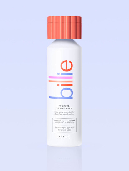 A bottle of Grapefruit-scented Billie Whipped Shave Cream on a light periwinkle background