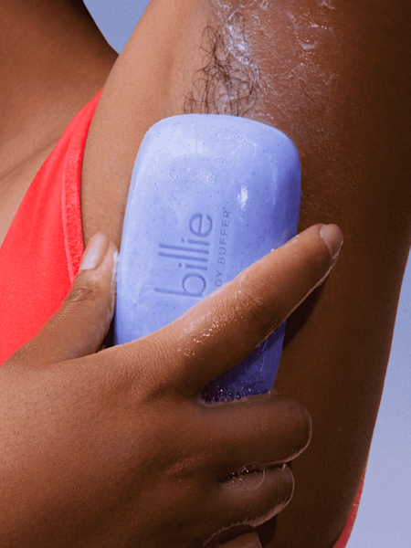 model using body buffer bar on her underarms