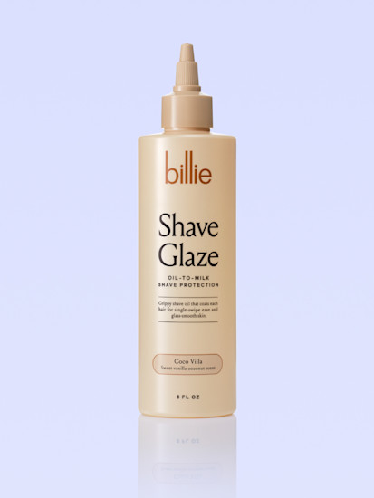 Beige bottle of Billie Shave Glaze oil-to-milk shaving product with Coco Villa scent against light blue background.