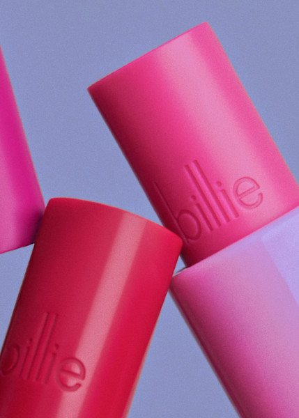 Dark pink and light pink lip balm sticks showing Billie logo