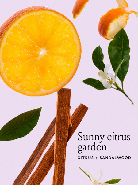 Orange and floral background with text that says sunny citrus garden, citrus + sandalwood