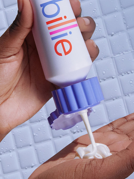 squeezing shave cream into palm
