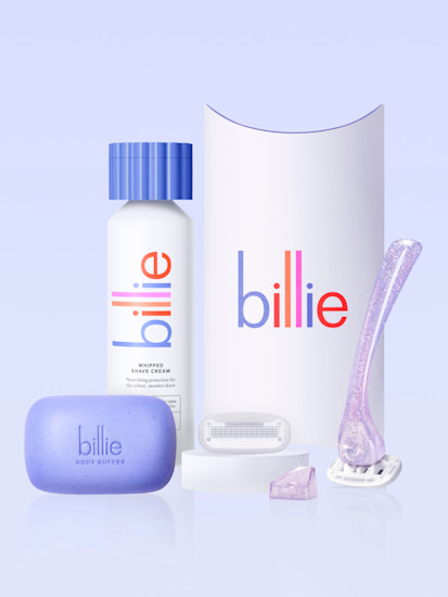 image of the whipped shave cream in the lavender scent, with a purple exfoliating bar, our razor starter kit packaging that says billie and a razor and magnetic holder in purple sparkle