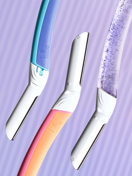 stylized image of dermaplane handles in waterpark, malibu, and sparkle in front of a light purple background