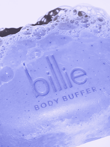 purple body buffer bar with soap suds