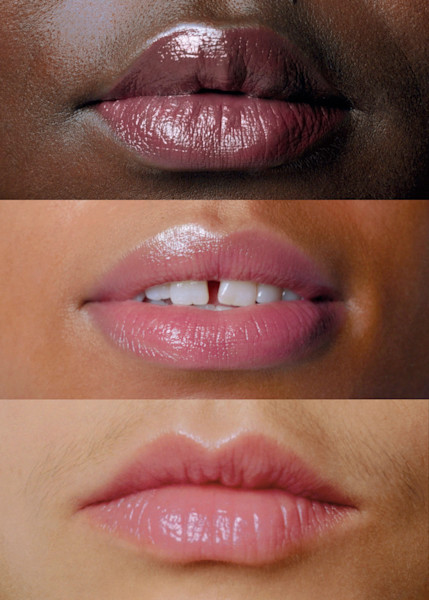 Three models with different skin tones' mouths wearing untinted lip balm