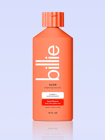 orange glow body wash on a periwinkle background