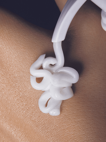 body lotion on model hand