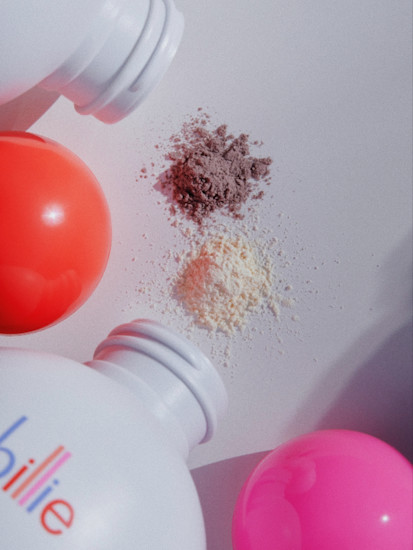 Light and dark hair Floof Dry shampoo bottles and powders on a light grey background.
