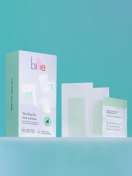 Face & bikini wax strips alongside wax strips box against a teal background